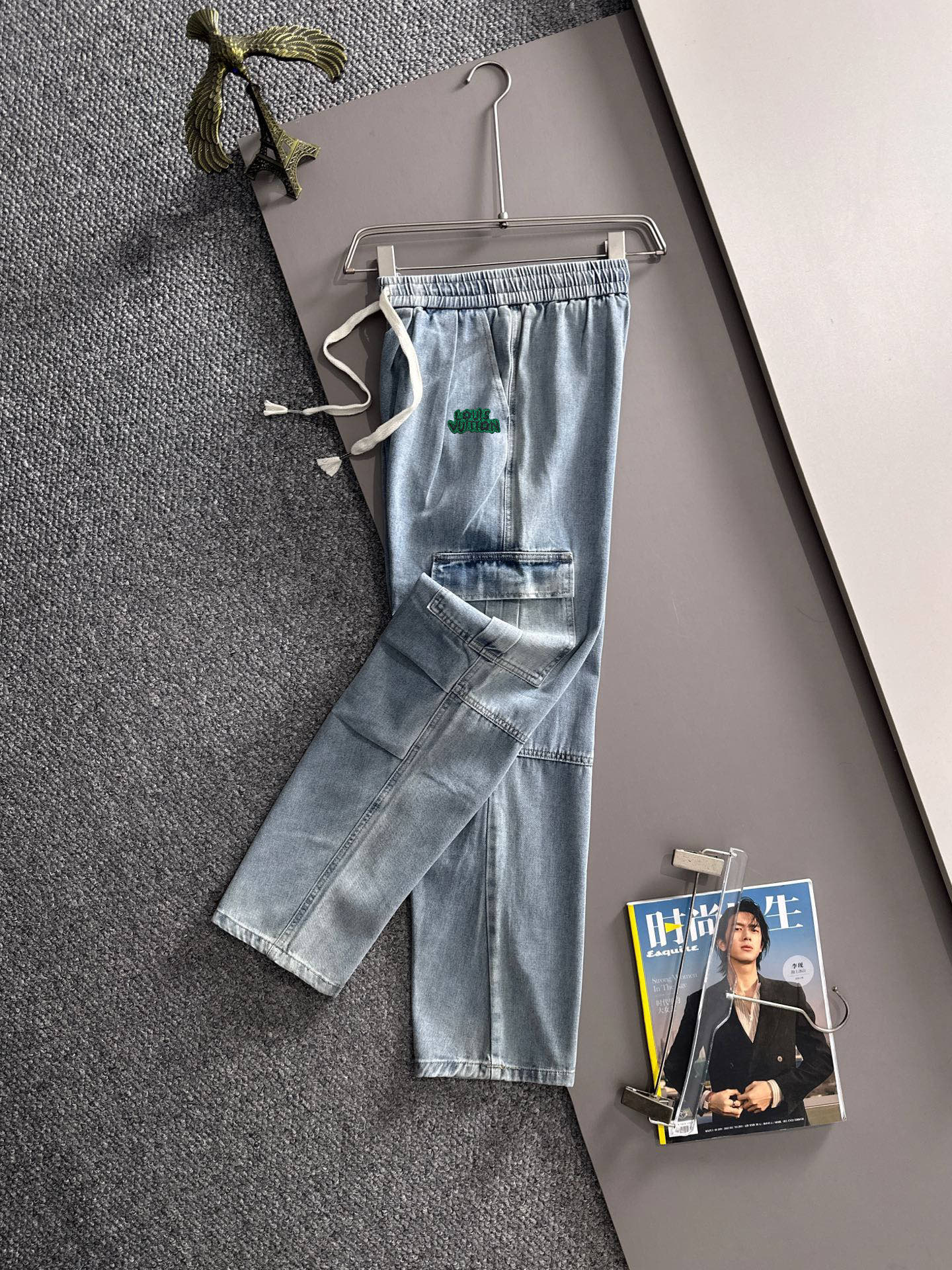 Louis Vuitton light blue denim cargo pants with elastic waist, drawstring, and front patch pockets