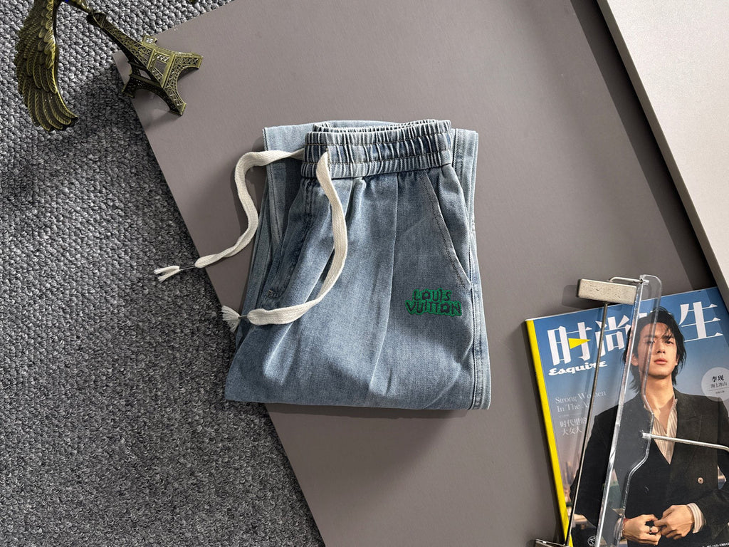 Louis Vuitton light blue denim jogger pants with elastic waistband and drawstring, cargo pockets