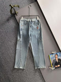 Light blue denim pants with belt loops, front button, and flap cargo-style pockets