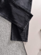 Dior dark denim pants close-up of folded cuff and front pocket detail