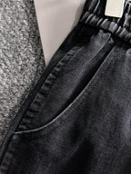 Dior dark denim pants close-up of waist seam and stitched drawstring openings