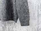 Dark gray fuzzy knit sweater sleeve and hem with straight cuffs