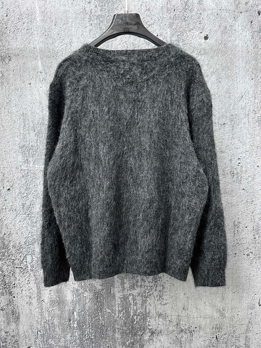 Dark gray fuzzy knit sweater with crew neck and plain back