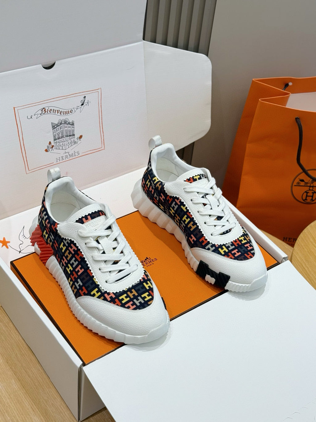Hermes unisex sneakers with white laces and multicolor logo-knit upper