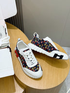 Hermes unisex sneakers on round stand, white laces and logo-pattern side panels