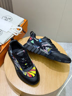 Black unisex sneakers pair with multicolor graphic uppers and lace closure.