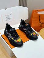 Black unisex lace-up sneakers with multicolor graphic uppers and chunky rubber sole.