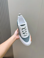 Hermes unisex lace-up sneaker, white and gray-green upper with orange edge detail