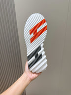 Hermes unisex sneaker outsole, white tread with orange graphic logo