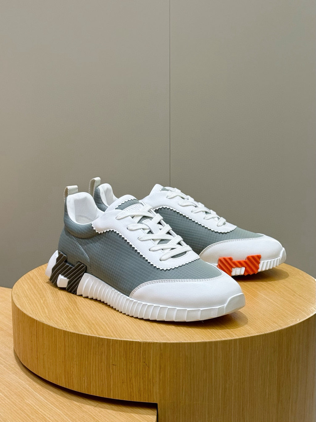 Hermes unisex lace-up sneakers, white/gray-green mesh with orange side pull tab