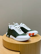 Hermes unisex sneakers with dark green textured upper, white laces, chunky white sole