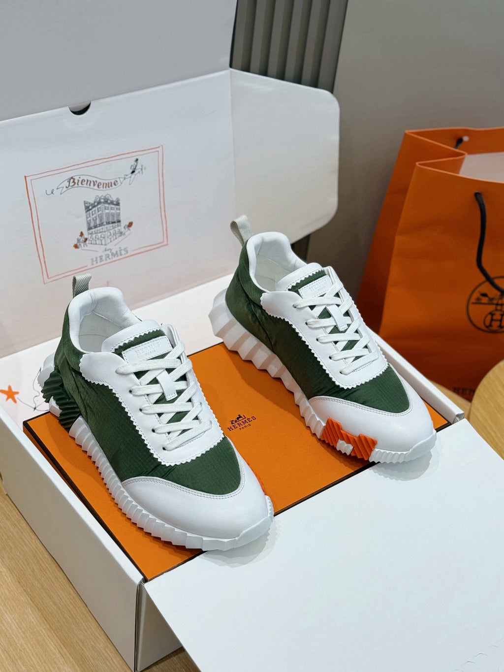 Hermes unisex sneakers in white and dark green, lace-up with contrast heel pull tab