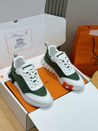 Hermes unisex sneakers in white and dark green, lace-up with contrast heel pull tab