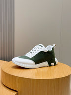 Hermes unisex sneakers, white rubber sole with dark green upper and white lace detail