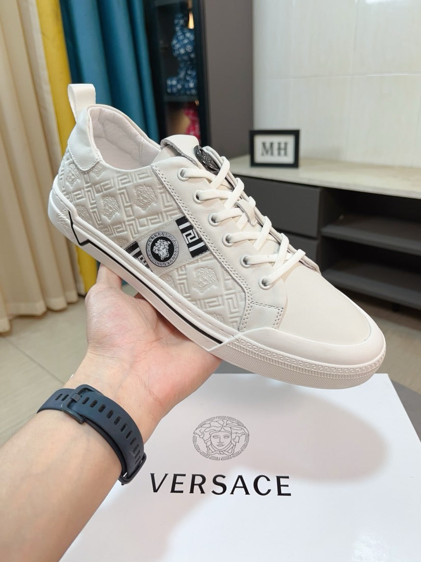 Versace low-top sneakers in off-white, lace-up with embossed logo pattern