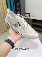 Versace low-top sneakers in off-white, lace-up with embossed logo pattern