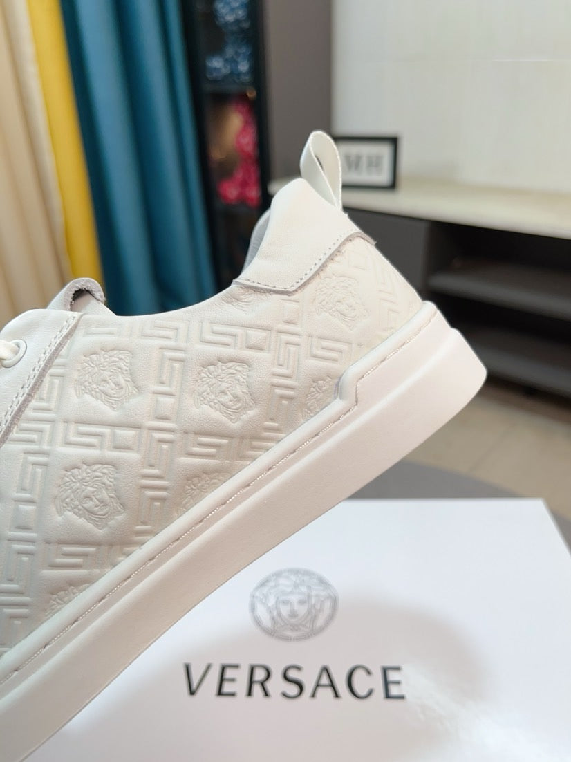Versace low-top sneakers in off-white, side view with textured upper