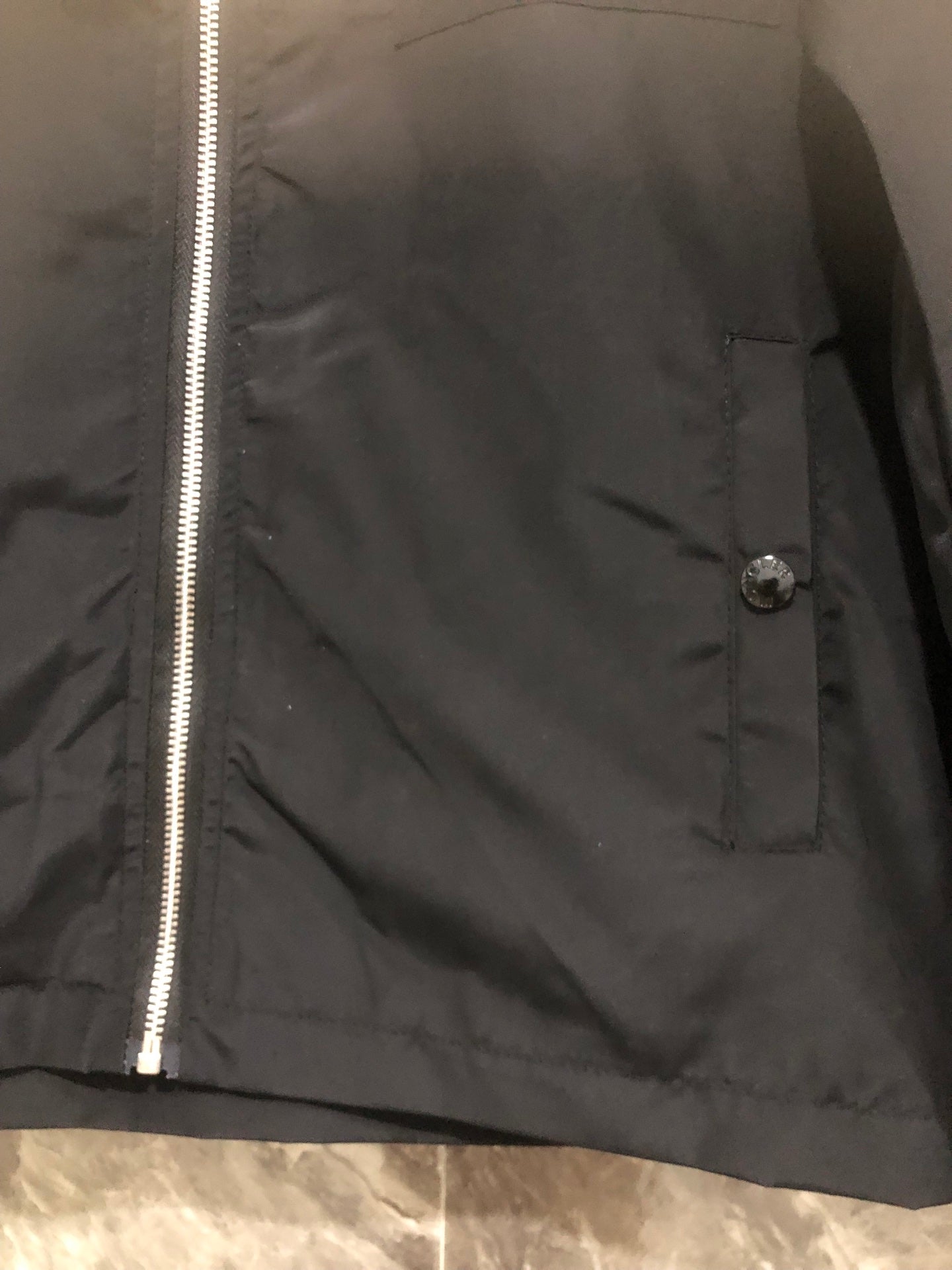 Moncler black jacket panel with zip, buttoned pocket, and snap closure