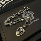 Silver-tone charm necklace with heart pendant charm and rectangular link chain