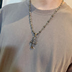 Chrome accessories cross pendant necklace worn, silver-tone chain with large cross pendant