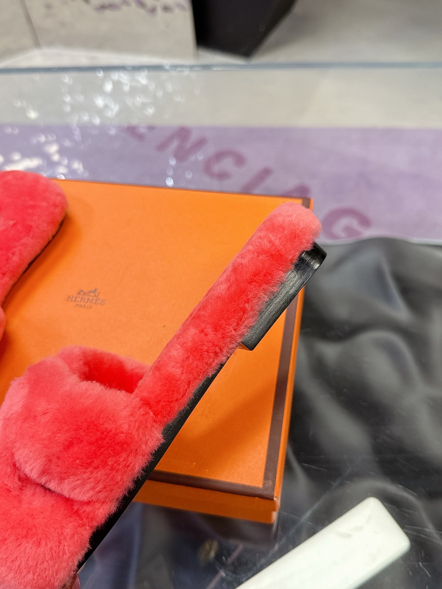Red faux-fur slide sandal with thick strap and soft padded footbed