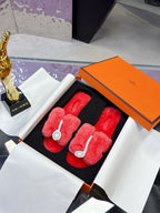 Red faux-fur slip-on sandals with double straps and white circular logo detail