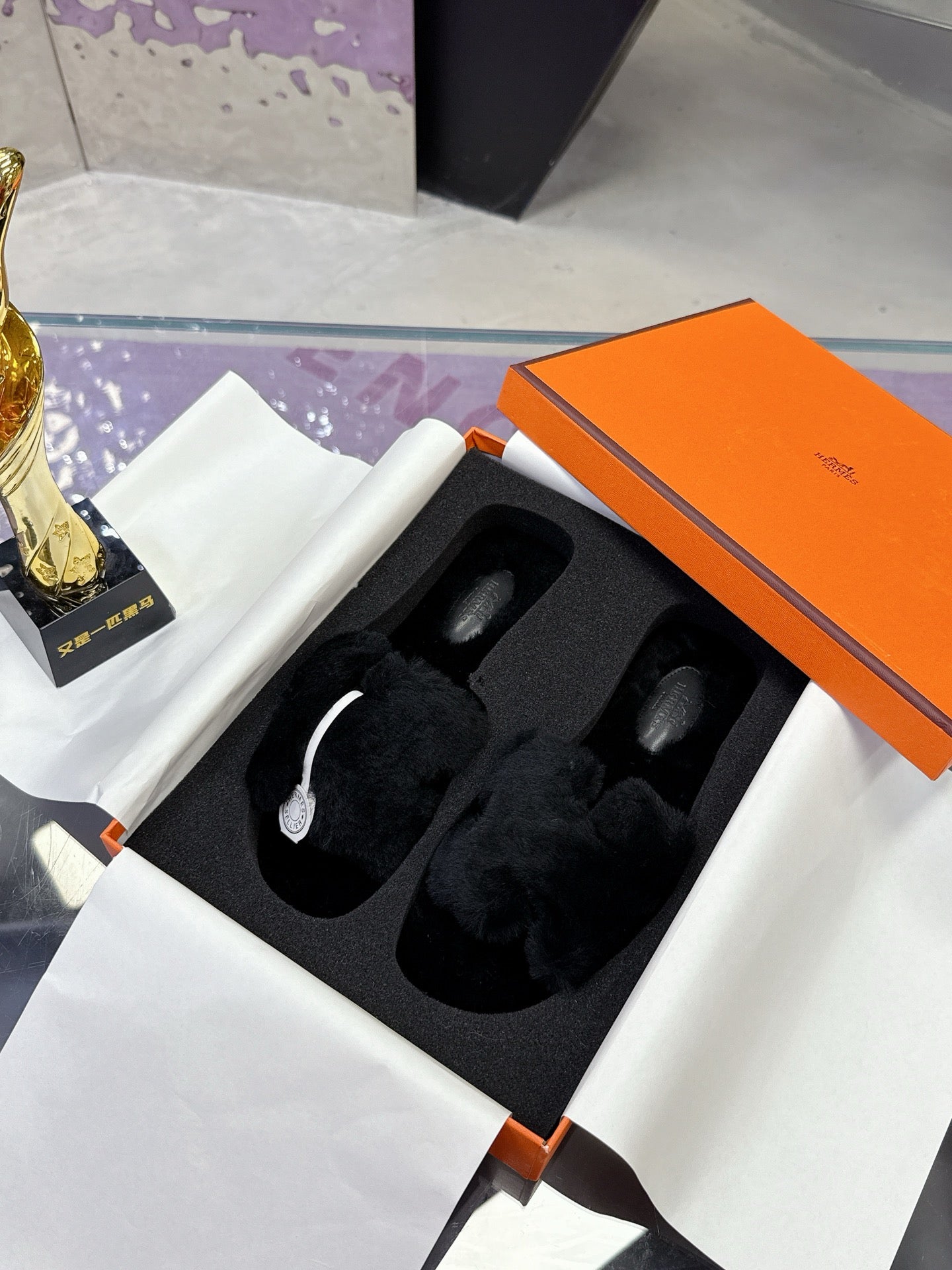 Hermes black faux-fur slide sandals with two wide cushioned crossover straps