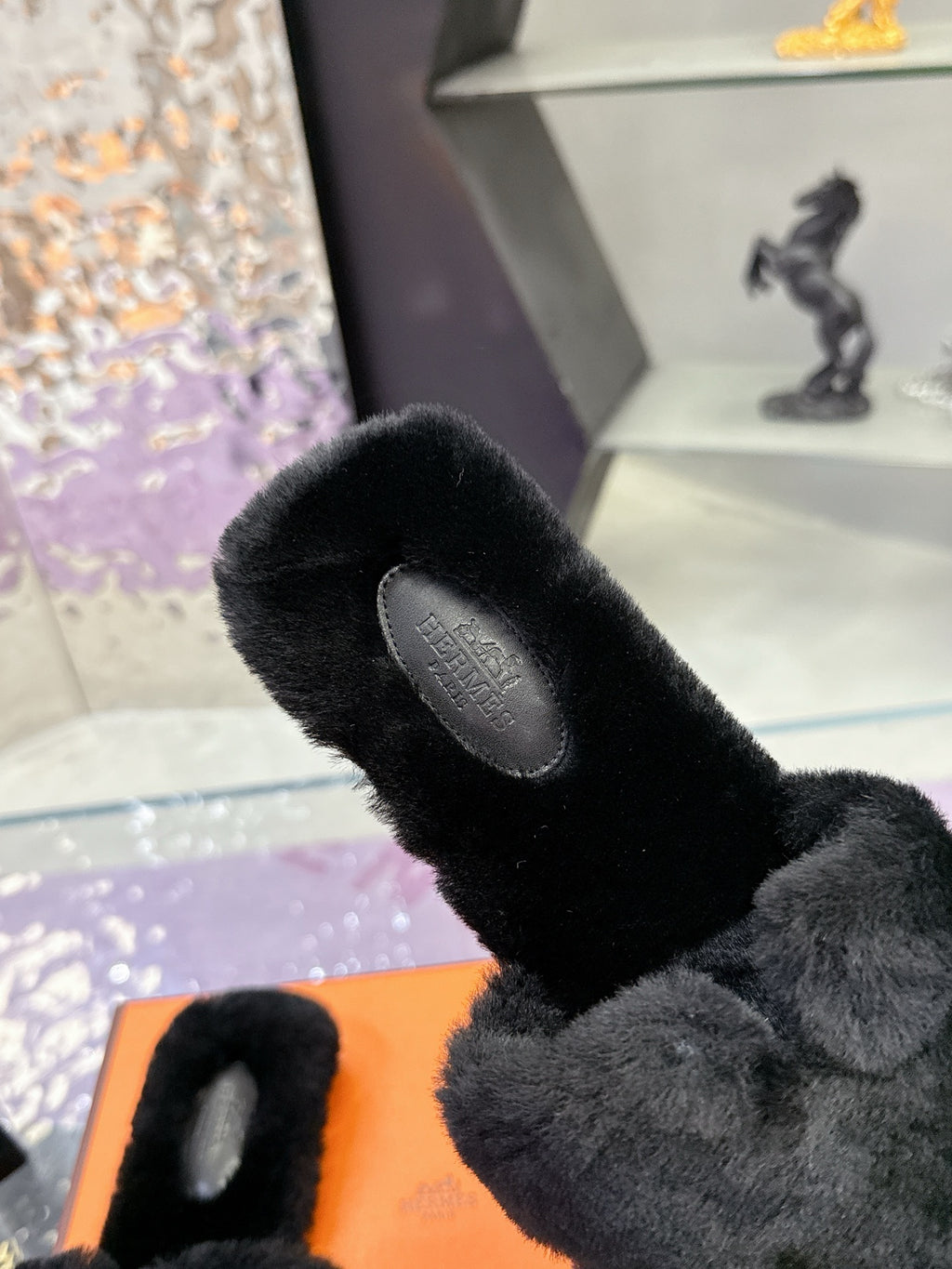 Hermes black faux-fur slide sandal with textured footbed and open toe