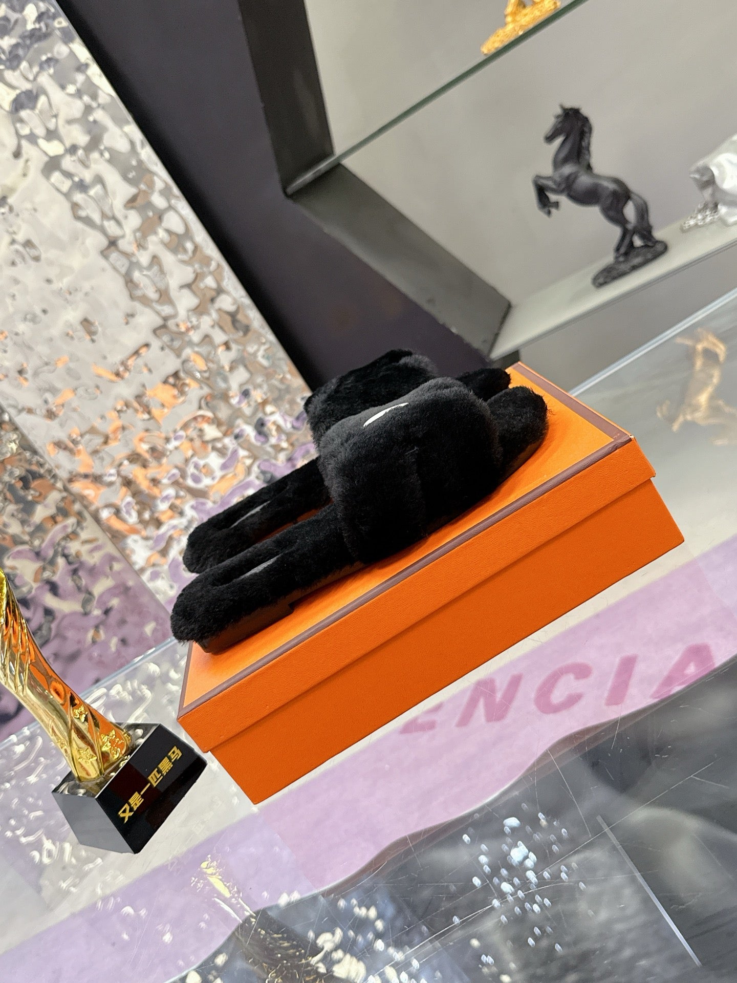 Hermes black faux-fur slide sandals with crossover strap detail