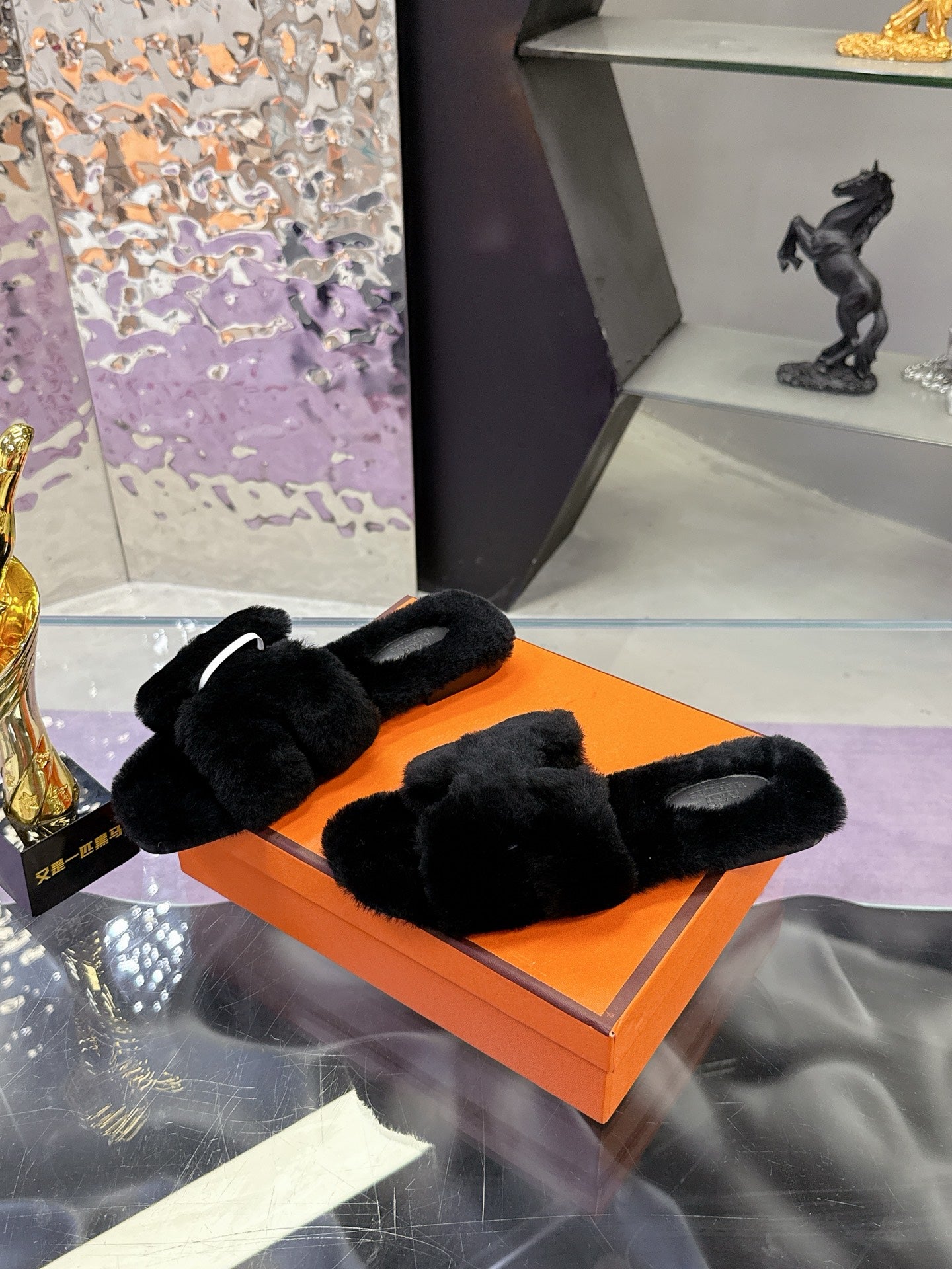 Hermes black faux-fur slide sandals with thick overlapping upper and contoured sole