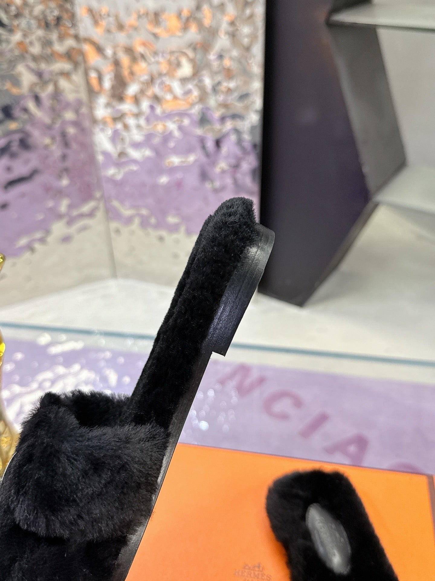 Hermes black faux-fur mule with long strap and open toe