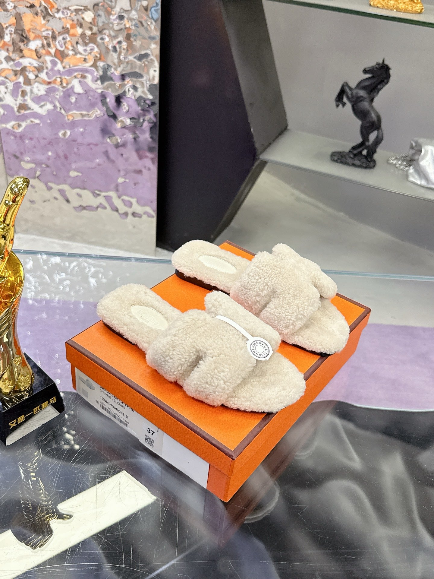 Hermes ladies shearling slides on orange box, cream fuzzy slides with logo patch
