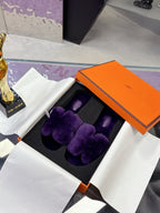 Hermes ladies purple faux-fur slides with bow strap, shown in open orange box
