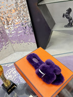 Hermes ladies purple faux-fur bow slides on orange box, top view