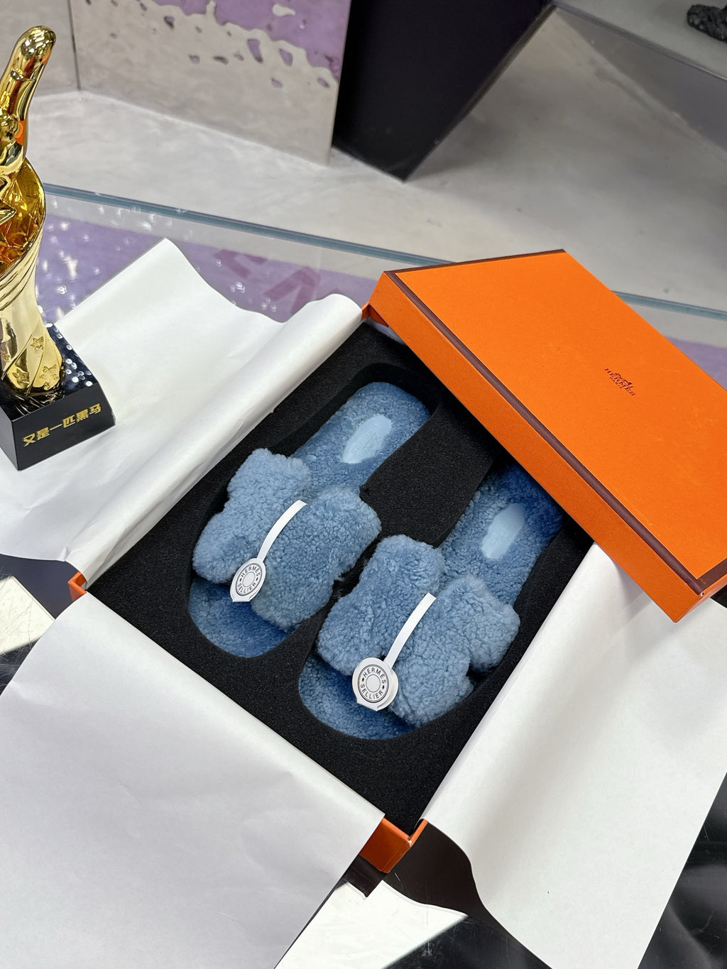 Hermes plush slip-on sandals, light blue teddy-fleece with white strap and round emblem