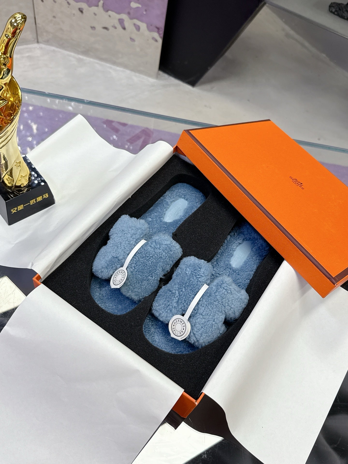 Hermes plush slip-on sandals, light blue teddy-fleece with white strap and round emblem