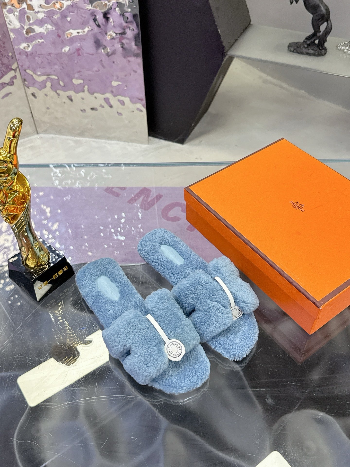 Hermes plush slip-on sandals, light blue teddy fabric with white strap and round emblem