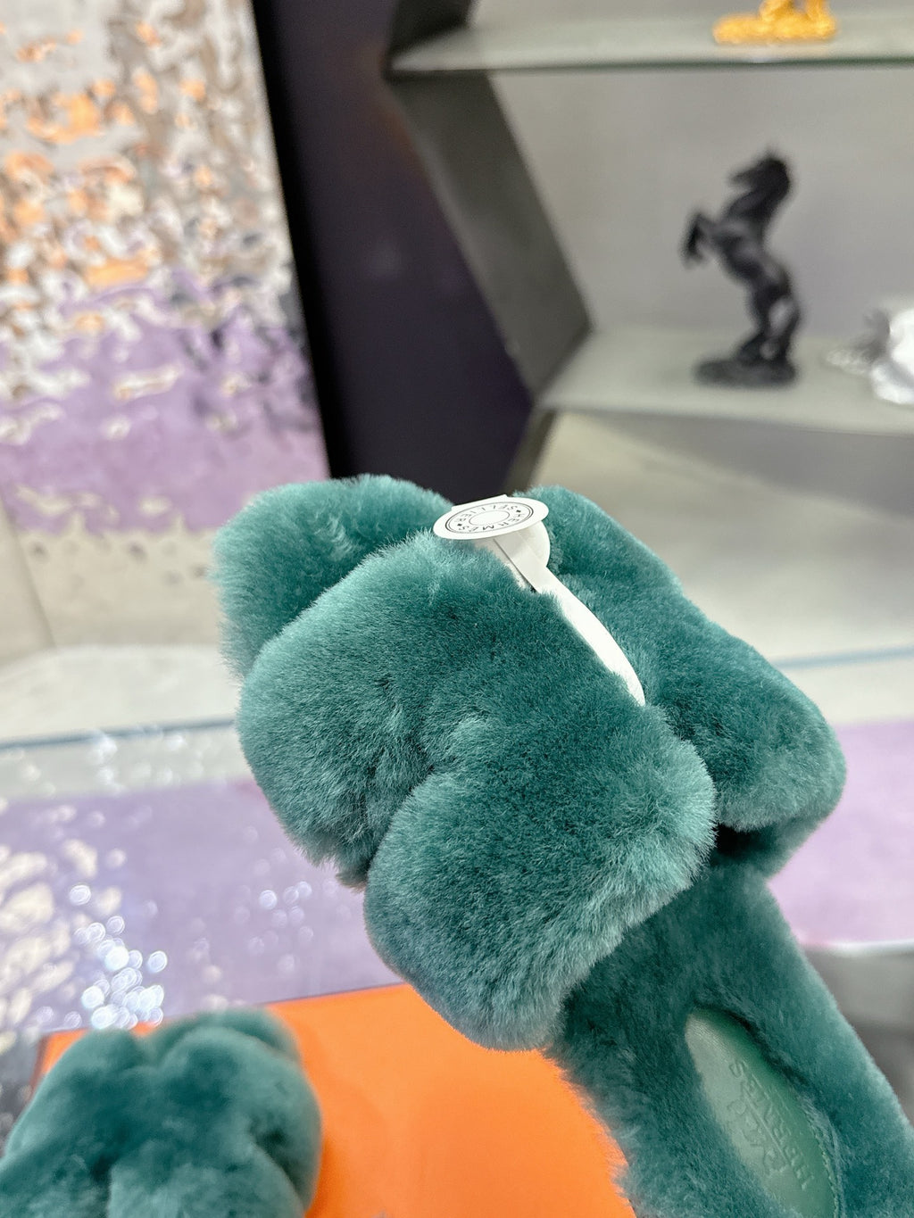 Hermes women’s teal plush bow slide sandal with white logo charm on strap