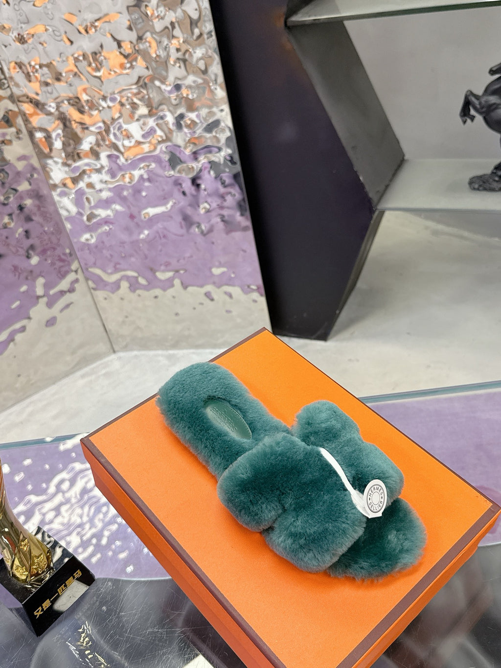 Hermes women’s teal plush slide sandal with bow strap and white logo medallion