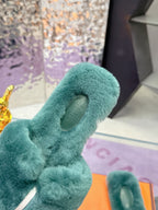 Hermes women’s teal plush slide sandal with looped bow strap and circular logo