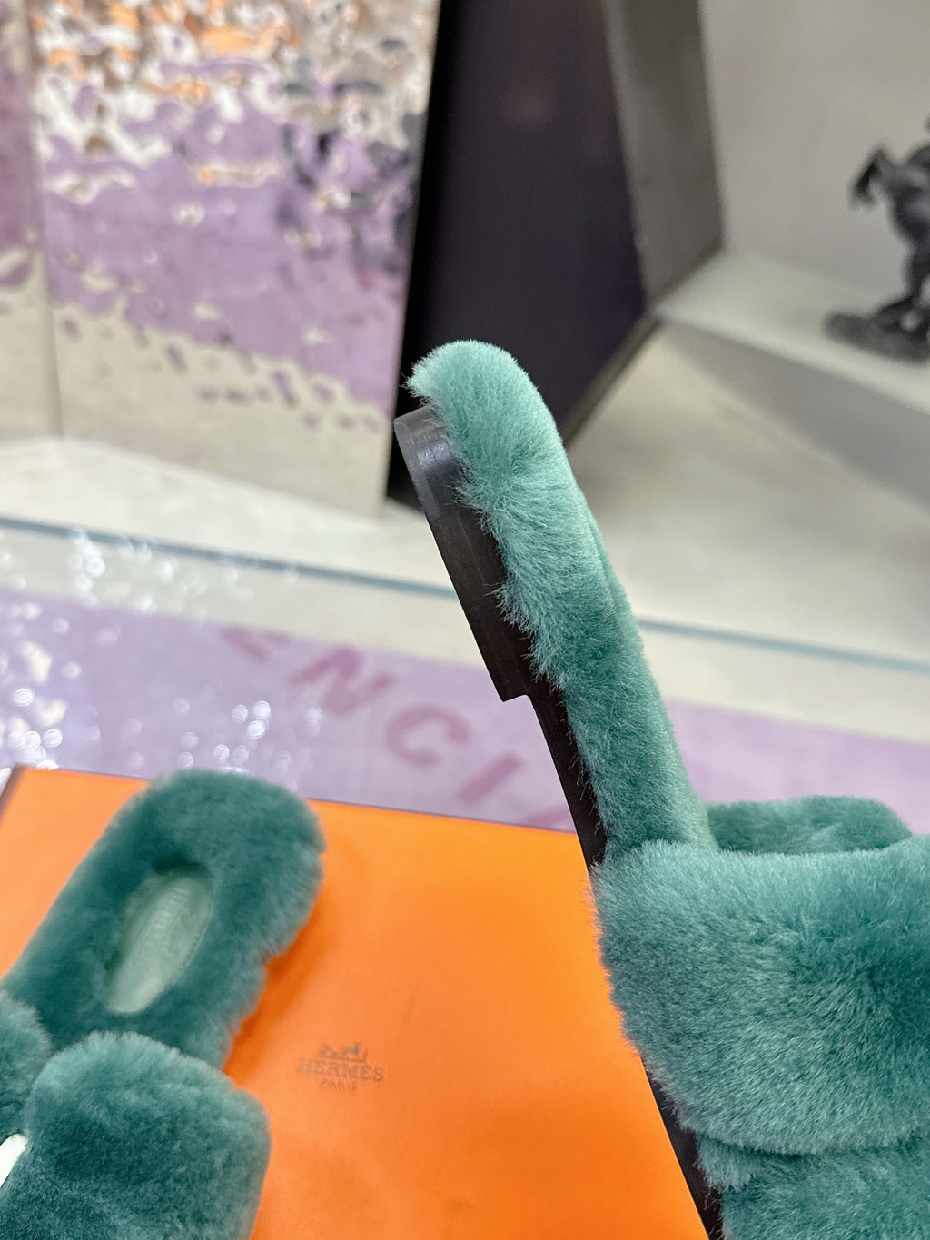 Hermes women’s teal plush slide sandal with long strap and textured upper