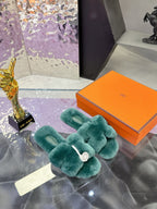Hermes women’s teal plush slide sandals with bow strap and white logo medallion