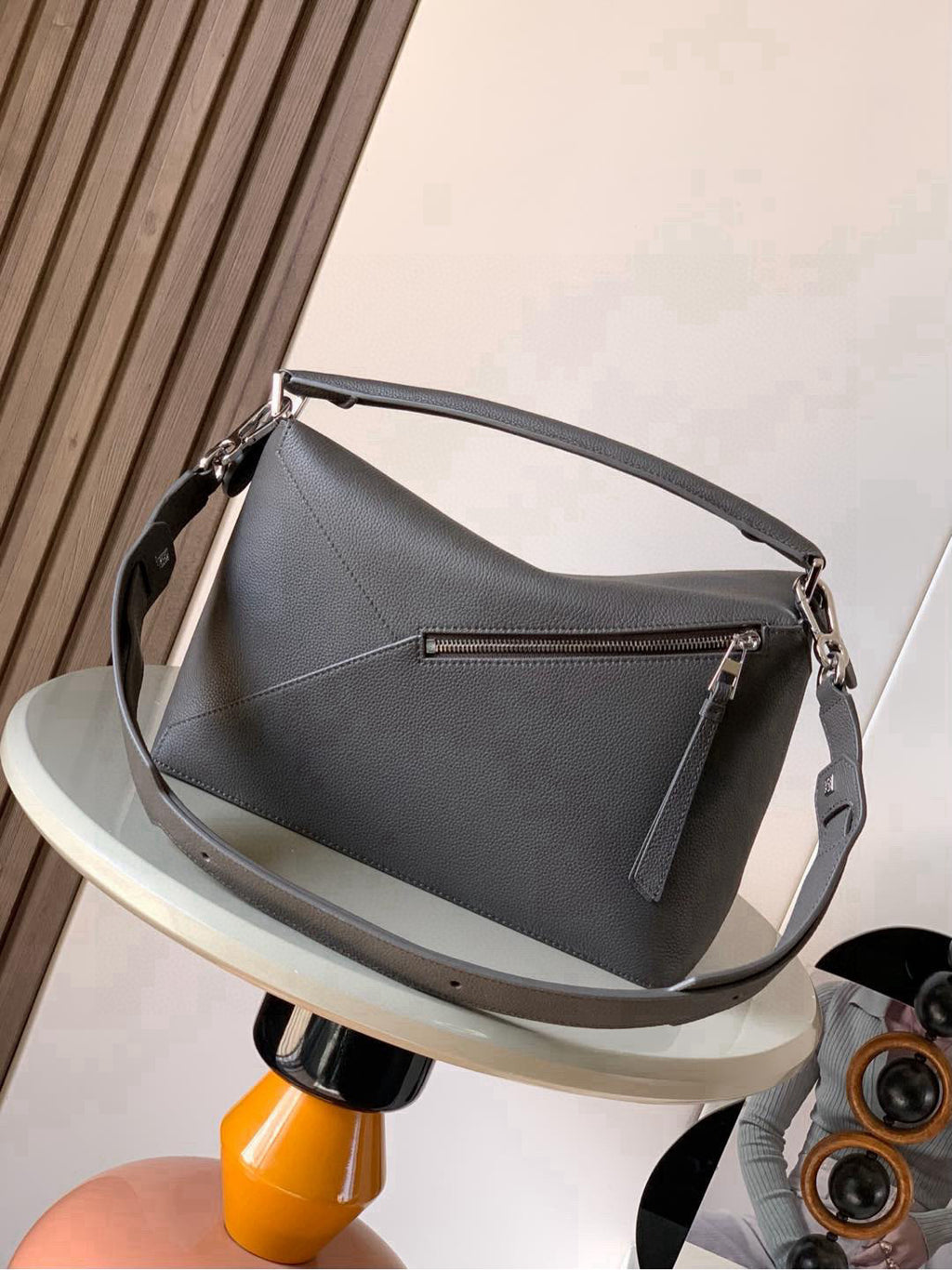 Loewe men's shoulder bag with flap and adjustable strap, front panel detail