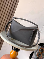 Loewe gray leather shoulder bag with flap front and crossbody strap with buckle