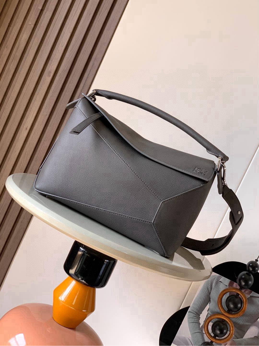 Loewe men's bag in dark gray leather, top handle and shoulder strap, flap front