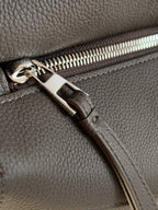 Loewe men's bag zipper pull and stitching detail on dark gray leather