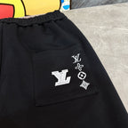 Louis Vuitton black pants pocket with LV logo patch and emblem symbols