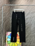 Louis Vuitton black drawstring pants with logo print down left leg
