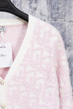 Dior pale pink V-neck cardigan with white trim and front button placket