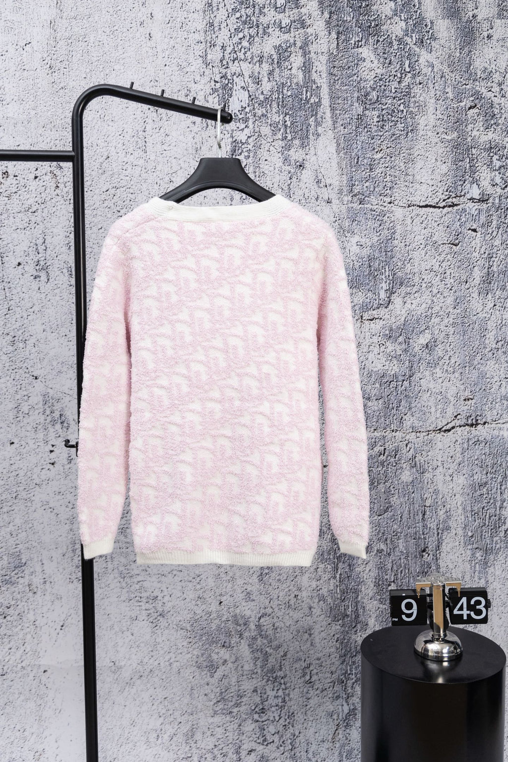 Dior long-sleeve cardigan, pale pink textured knit with button closure, back view